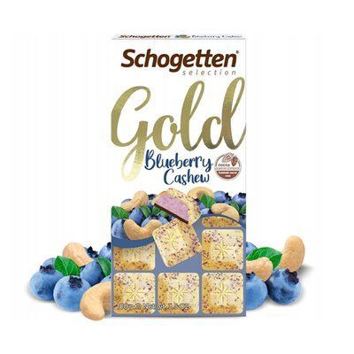 Белый шоколад Schogetten Gold с черничными хлопьями и начинкой из черничного крема 100 грамм Германия 0732 фото